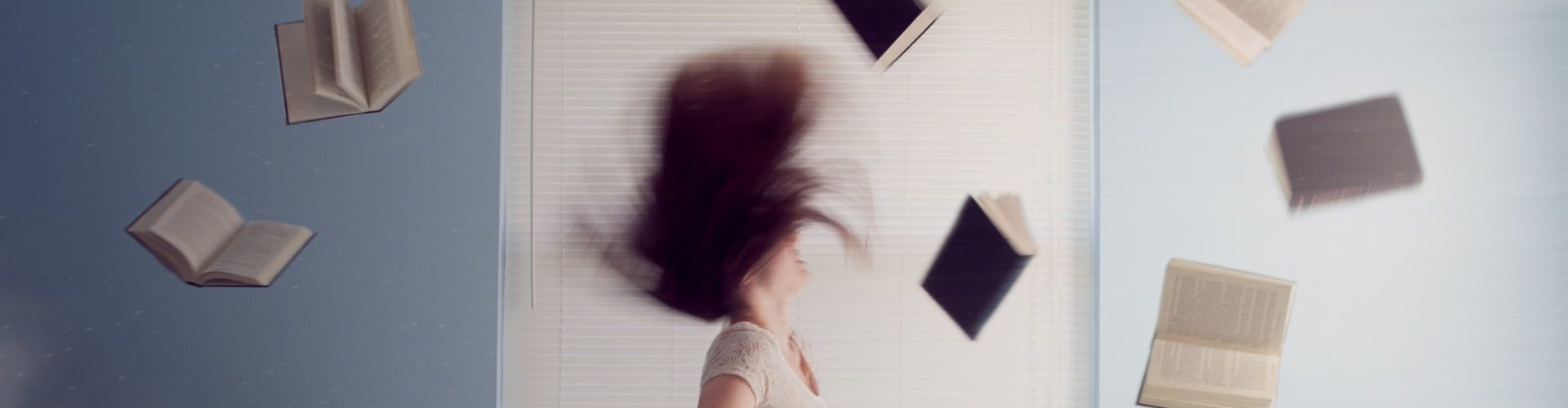 Woman with books surrounding her